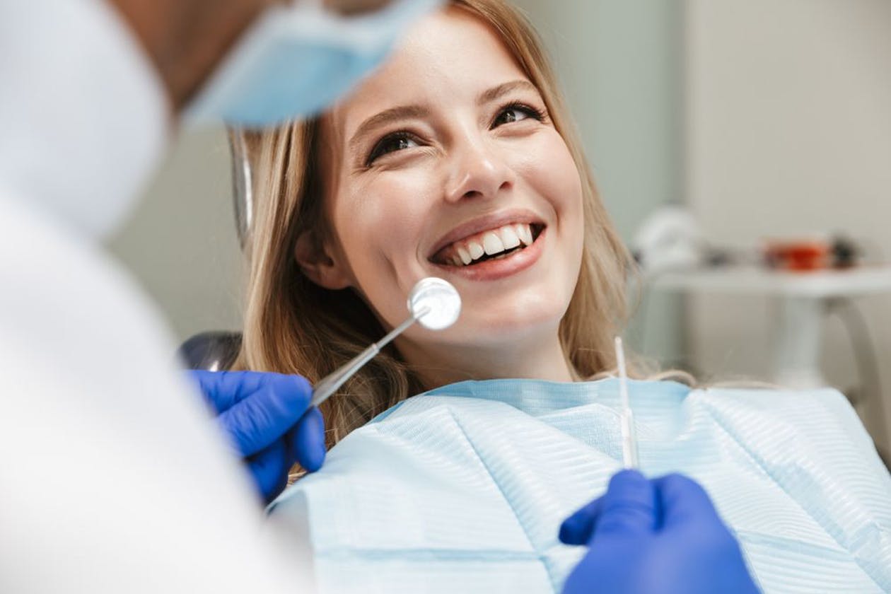 What are some of the benefits of visiting a dentist regularly?